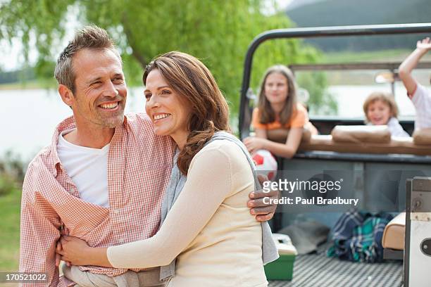 family enjoying day at lake - two parents stock pictures, royalty-free photos & images