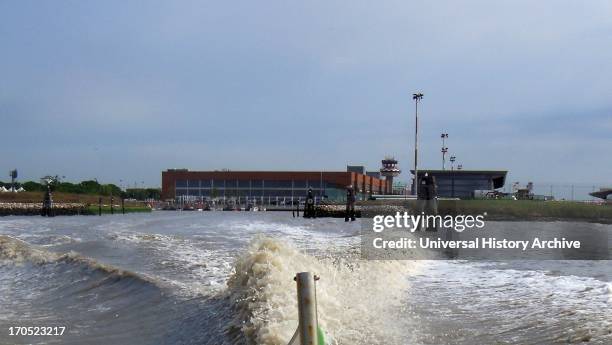 Wake of a speedboat headed for Venice from Marco Polo airport. The wooden posts mark the route the boats must take.