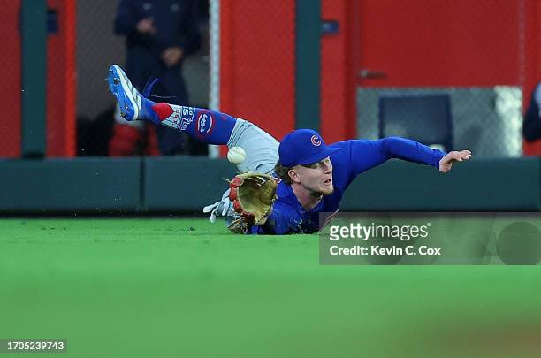 Pete Crow-Armstrong of the Chicago Cubs dives and fails to catch this double hit by Michael Harris II of the Atlanta Braves in the eighth inning at...