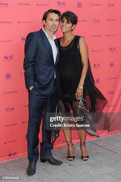 Olivier Martinez and Halle Berry attend the 'Toiles Enchantees' red carpet as part of The Champs Elysees Film Festival 2013 at Publicis Champs...