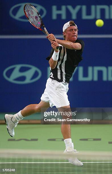 Lleyton Hewitt of Australia in action against Dominik Hrbaty of the Slovak Republic during the 2002/2003 Hyundai Hopman Cup at the Perth Superdome in...