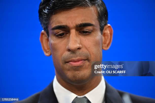 Britain's Prime Minister Rishi Sunak addresses delegates at the annual Conservative Party Conference in Manchester, northern England, on October 4,...