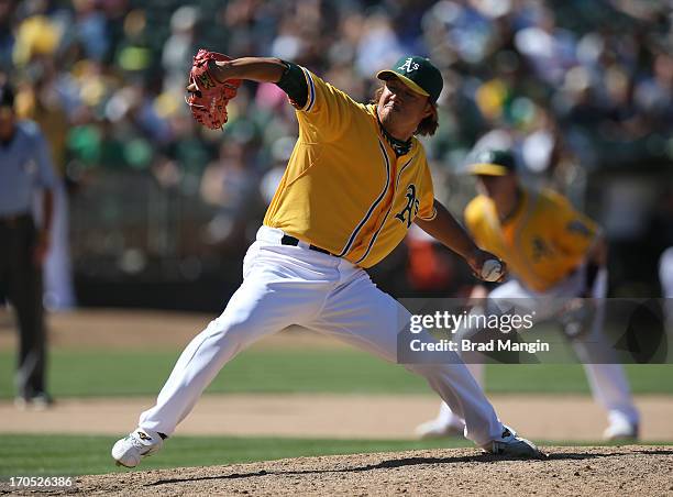 Hideki Okajima of the Oakland Athletics pitches against the New York Yankees during the game at O.co Coliseum on Thursday June 13, 2013 in Oakland,...