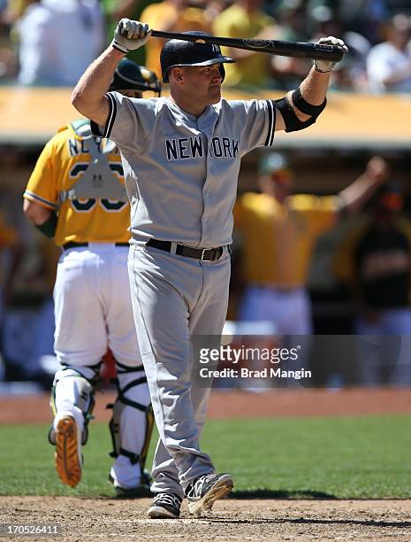 Kevin Youkilis of the New York Yankees reacts after striking out against the Oakland Athletics during the game at O.co Coliseum on Thursday June 13,...