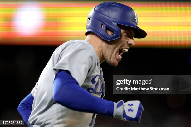 Freddie Freeman of the Los Angeles Dodgers celebrates as he circle the bases after hiting a 3 RBI home run against the Colorado Rockies in the eighth...