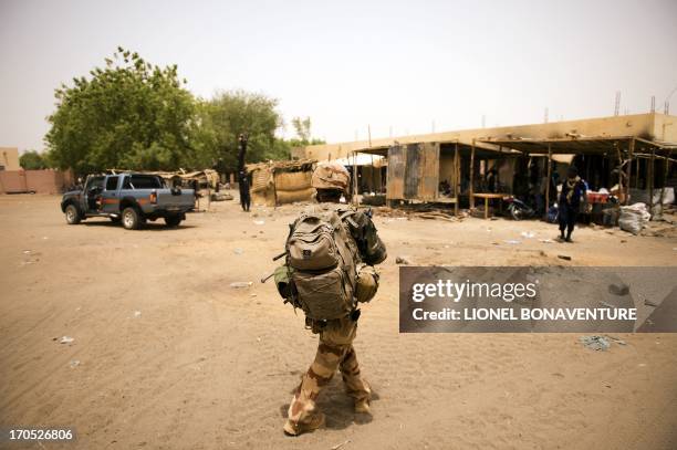 French soldier patrols in the street in Gao on June 13, 2013. Gao fell in March last year to Tuareg rebels who declared the independence of the...