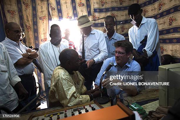 French Junior Minister for Development Pascal Canfin talks as he visits a radio station in Gao on June 13, 2013. Gao fell in March last year to...