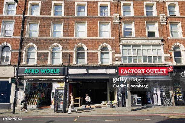 Shops line the ground floors of residential buildings on Kingsland High Street in the Hackney borough of London, UK, on Friday, Sept. 22, 2023. As...