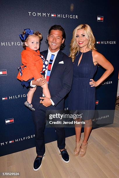 Pro surfer Kalani Robb, wife Kortney Robb and daughter Kea Robb attend the grand opening of the Tommy Hilfiger store at Fashion Valley Mall on June...