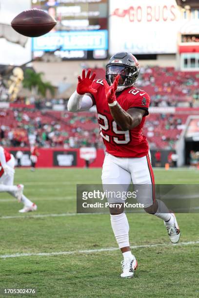 Christian Izien of the Tampa Bay Buccaneers warms up prior to an NFL football game against the Philadelphia Eagles at Raymond James Stadium on...