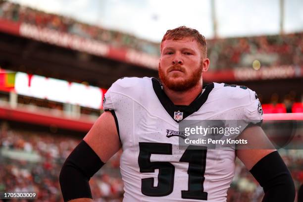 Cam Jurgens of the Philadelphia Eagles looks on from the sideline during the national anthem prior to an NFL football game against the Tampa Bay...