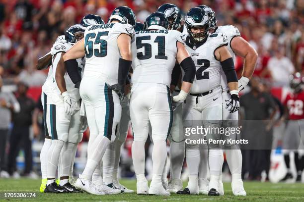 Philadelphia Eagles offense huddles during an NFL football game against the Tampa Bay Buccaneers at Raymond James Stadium on September 25, 2023 in...