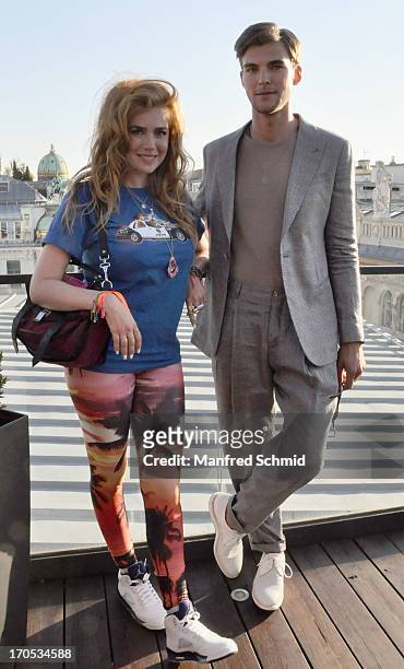 Palina Rojinskis and Patrick Kafka pose for a photograph during the Vienna Fashion Night on June 12, 2013 in Vienna, Austria.