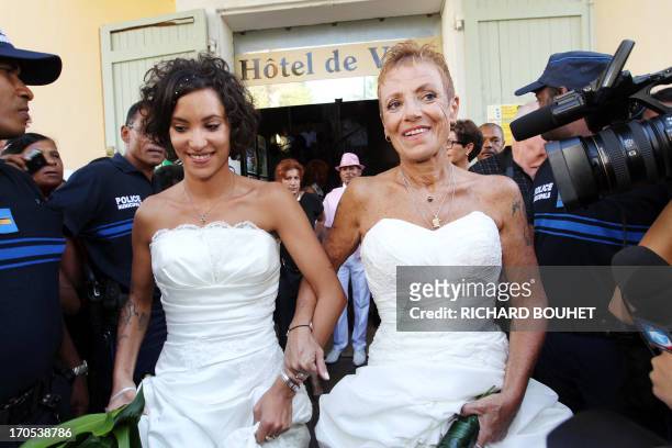 Corinne Denis and Laurence Cerveaux celebrate after being declared married at Saint-Paul de la Reunion city hall during the first official gay...