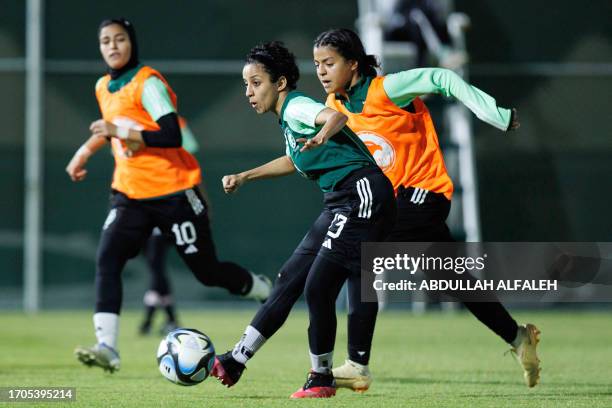 Players of Saudi women's football team attend a training session in Taif on September 21, 2023. The Saudi women's national team ran through a...