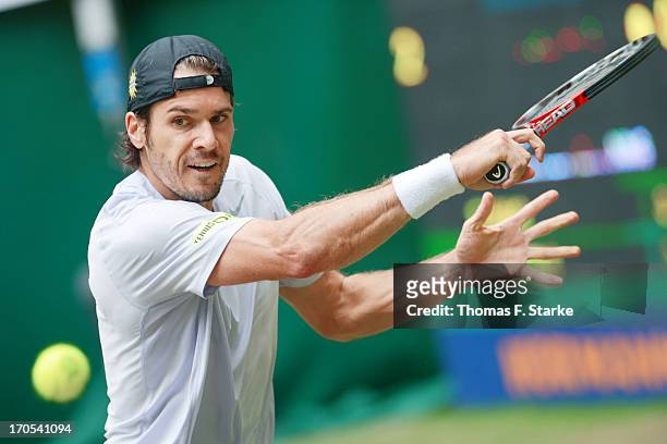 Tommy Haas of Germany plays a backhand in his quarter final match against Gael Monfils of France during day five of the Gerry Weber Open at Gerry...
