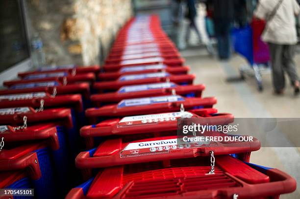 Picture taken of shopping carts in a Carrefour supermarket, on June 14, 2013 in Sainte-Geneviève-des-Bois, outside Paris. Installed in...