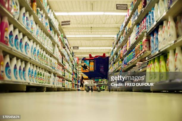Cart shopping is seen in a rack of a Carrefour supermarket, on June 14, 2013 in Sainte-Geneviève-des-Bois, outside Paris. Installed in...