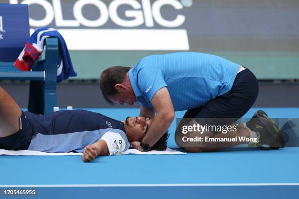 Lorenzo Sonego of Italy receives treatment during the match against Ugo Humbert of France during day 3 of the 2023 China Open at National Tennis...