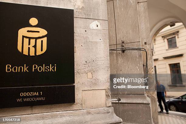 Logo sits on display outside a PKO Bank Polski SA bank branch in Wroclaw, Poland, on Friday, June 14, 2013. PKO Bank Polski SA, Poland's biggest...