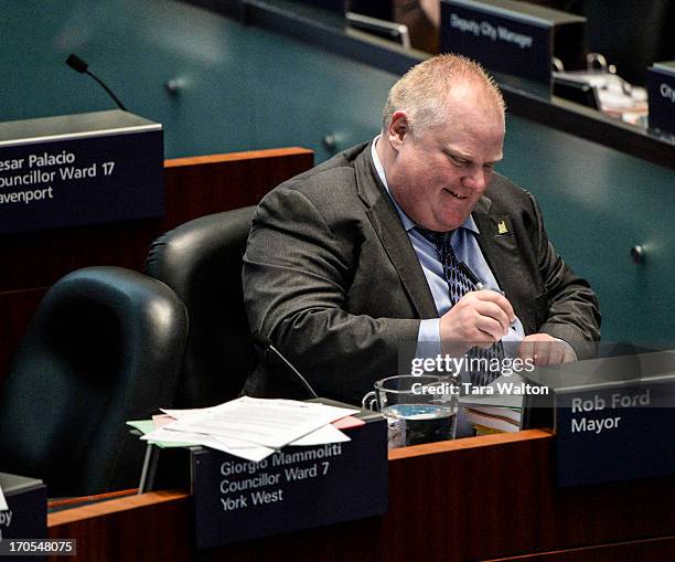 Toronto Mayor Rob Ford in council chambers. Earlier today Toronto Police launched a massive predawn raid, as part of Project Traveller, targeting...