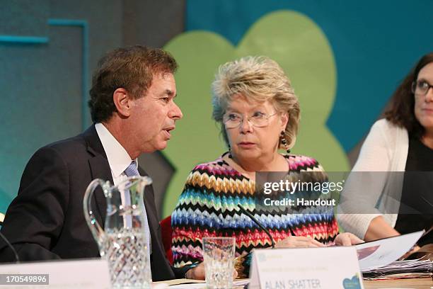 In this handout photo provided by Department of The Taoiseach, Alan Shatter , Minister for Justice, Equality and Defence, and Viviane Reding,...