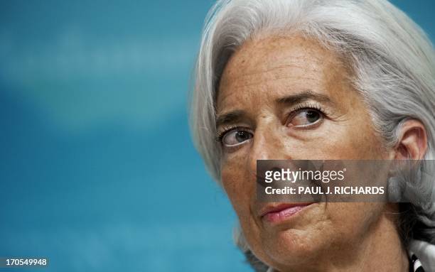 Christine Lagarde, Managing Director of the International Monetary Fund , delivers remarks on the US economy during a press conference June 14, 2013...