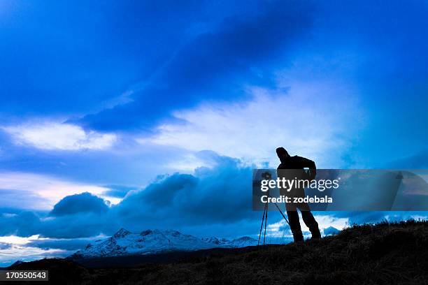 photographer with tripod at dawn - cameraman stock pictures, royalty-free photos & images