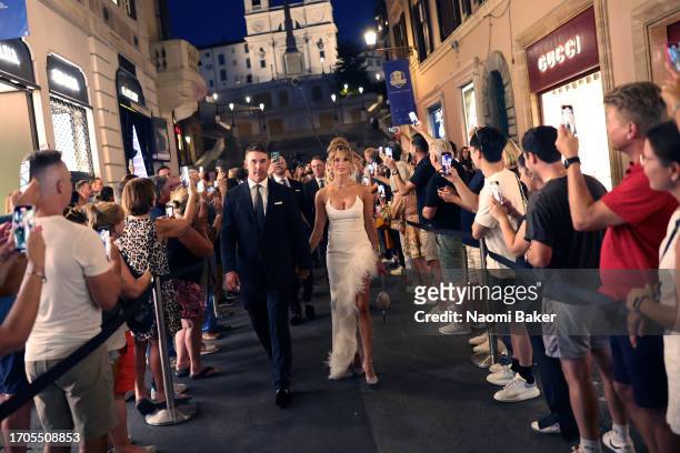 Brooks Koepka of Team USA and wife Jena Sims pose for photos at the Spanish Steps prior to the 2023 Ryder Cup at Marco Simone Golf Club on September...