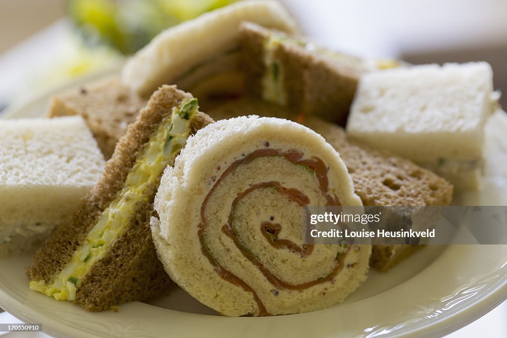 A plate of small sandwiches