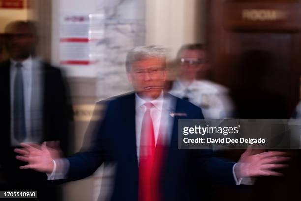 Former President Donald Trump speaks on the third day of his civil fraud trial at New York State Supreme Court on October 04, 2023 in New York City....