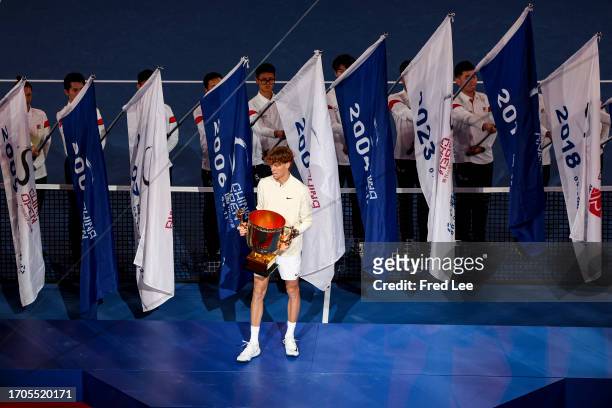 Jannik Sinner of Italy poses with the trophy after the Men's Singles Final on day 9 of the 2023 China Open at National Tennis Center on October 4,...