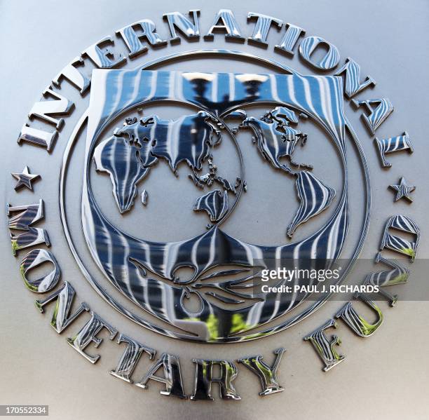 The seal of the International Monetary Fund is seen shortly after Christine Lagarde, Managing Director, spoke on the US economy during a press...