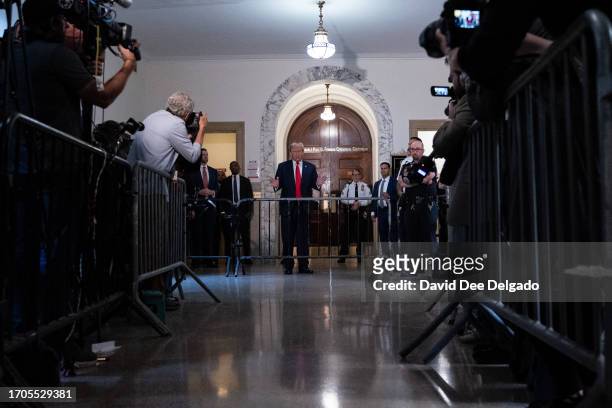 Former U.S. President Donald Trump speaks to the media as he appears for his civil fraud trial at New York State Supreme Court on October 04, 2023 in...