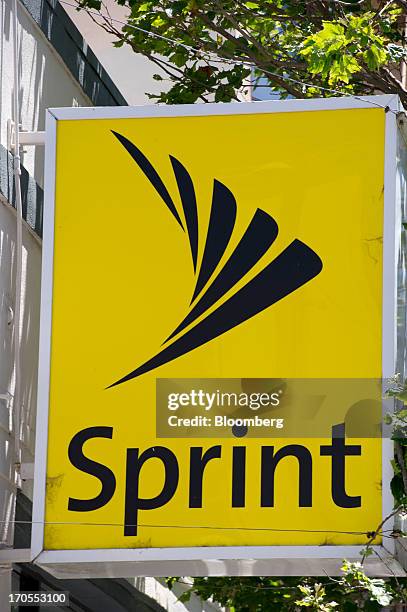 Sprint Nextel Corp. Signage is displayed on the facade of a store in San Francisco, California, U.S., on Thursday, June 13, 2013. SoftBank Corp....