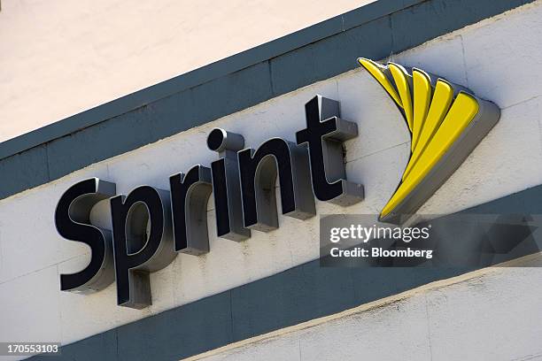 Sprint Nextel Corp. Signage is displayed on the facade of a store in San Francisco, California, U.S., on Thursday, June 13, 2013. SoftBank Corp....