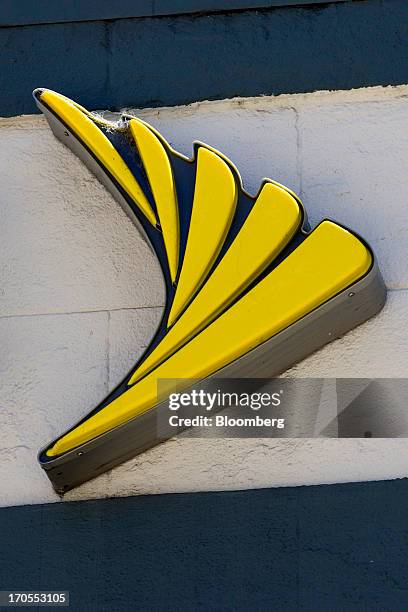 The Sprint Nextel Corp. Logo is displayed on the facade of a store in San Francisco, California, U.S., on Thursday, June 13, 2013. SoftBank Corp....
