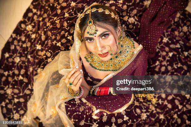 beautiful traditional indian bridal in lehenga and jewelry. - bangle stock pictures, royalty-free photos & images