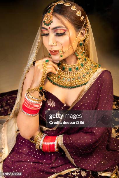 beautiful traditional indian bridal in lehenga and jewelry. - wedding jewellery stock pictures, royalty-free photos & images