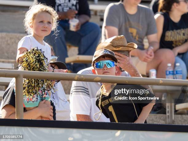 Young Western Michigan Broncos fans dance during the college football game between the Ball State Cardinals and Western Michigan Broncos on September...