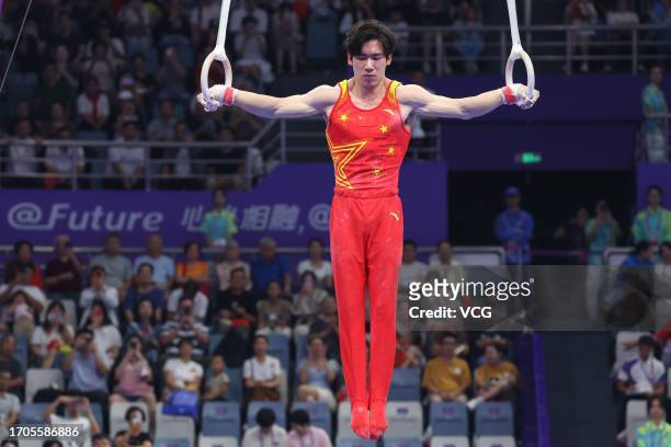 Zhang Boheng of Team China competes on the Rings in the Artistic Gymnastics - Men's All-Around Final on day three of the 19th Asian Games at...