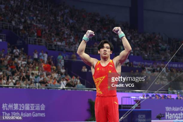 Zhang Boheng of Team China reacts in the Artistic Gymnastics - Men's All-Around Final on day three of the 19th Asian Games at Huanglong Sports Centre...