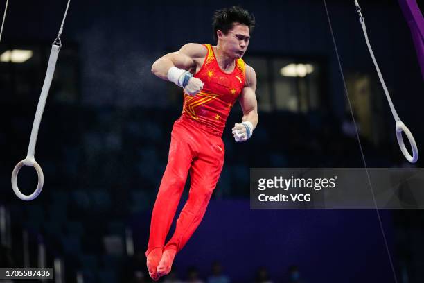 Lan Xingyu of Team China competes on the Rings in the Artistic Gymnastics - Men's All-Around Final on day three of the 19th Asian Games at Huanglong...