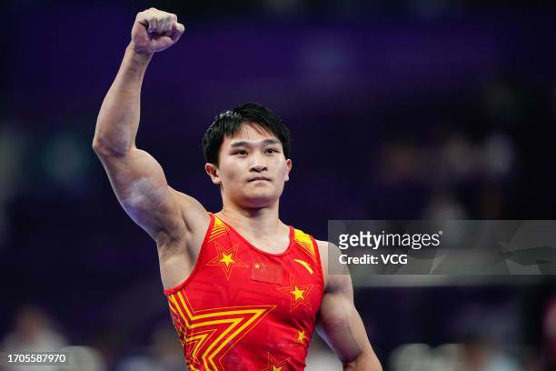 Lan Xingyu of Team China reacts in the Artistic Gymnastics - Men's All-Around Final on day three of the 19th Asian Games at Huanglong Sports Centre...