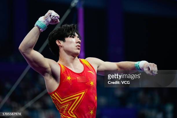 Zhang Boheng of Team China reacts in the Artistic Gymnastics - Men's All-Around Final on day three of the 19th Asian Games at Huanglong Sports Centre...