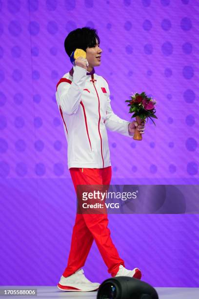 Gold medalist Zhang Boheng of Team China poses during the medal ceremony for the Artistic Gymnastics - Men's All-Around Final on day three of the...