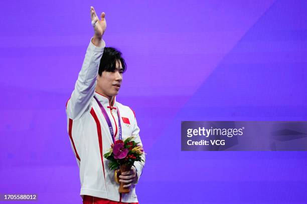 Gold medalist Zhang Boheng of Team China poses during the medal ceremony for the Artistic Gymnastics - Men's All-Around Final on day three of the...