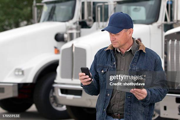 multitasking truck driver - truck driver stock pictures, royalty-free photos & images