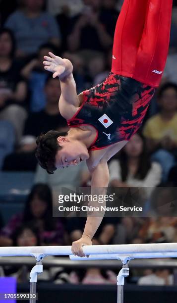 Takeru Kitazono of Team Japan competes on the Parallel Bars in the Artistic Gymnastics - Men's All-Around Final on day three of the 19th Asian Games...