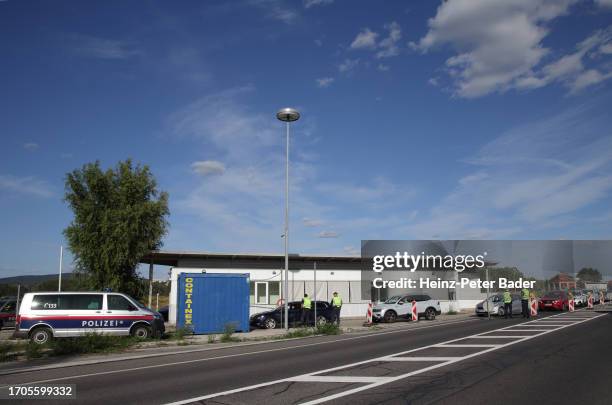 Austrian police check cars and vans arriving from Slovakia at the Austrian-Slovak border on October 4, 2023 in Berg, Austria. Austria began border...